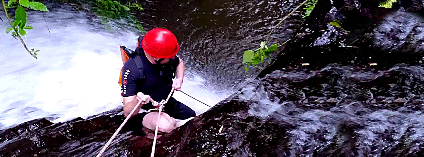 Man abseiling into a canyon